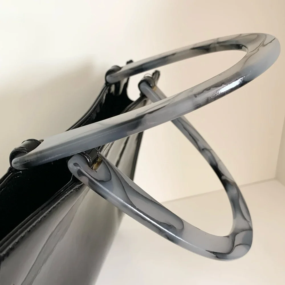Hold NWOT Neiman Marcus black patent marble handle modern bag